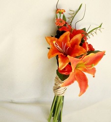 A bundle of various tiger lilies with the stems tied together.